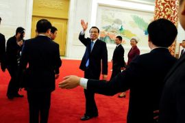 China's Premier Li Keqiang waves as he leaves the room after a news conference following the closing ceremony of China's National People's Congress (NPC) at the Great Hall of the People in Beijing, China, March 15, 2017. REUTERS/Thomas Peter