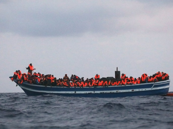 Over 400 migrants are seen overcrowding a wooden vessel drifting in central Mediterranean Sea off the Libyan coast, March 29, 2017 during a search and rescue operation by Spanish NGO Proactiva Open Arms. REUTERS/Yannis Behrakis TPX IMAGES OF THE DAY