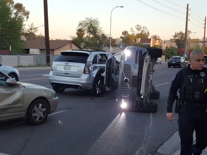 A self-driven Volvo SUV owned and operated by Uber Technologies Inc. is flipped on its side after a collision in Tempe, Arizona, U.S. on March 24, 2017. Courtesy FRESCO NEWS/Mark Beach/Handout via REUTERS ATTENTION EDITORS - THIS IMAGE WAS PROVIDED BY A THIRD PARTY. EDITORIAL USE ONLY. MANDATORY CREDIT