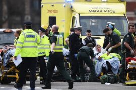 LONDON, ENGLAND - MARCH 22: Members of the public are treated by emergency services near Westminster Bridge and the Houses of Parliament on March 22, 2017 in London, England. A police officer has been stabbed near to the British Parliament and the alleged assailant shot by armed police. Scotland Yard report they have been called to an incident on Westminster Bridge where several people have been injured by a car. (Photo by Carl Court/Getty Images)