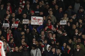 Britain Football Soccer - Arsenal v Bayern Munich - UEFA Champions League Round of 16 Second Leg - Emirates Stadium, London, England - 7/3/17 Arsenal fans hold up banners protesting against Arsenal manager Arsene Wenger Action Images via Reuters / John Sibley Livepic
