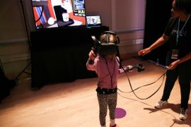 Cecelia Johnston, 7, interacts in the virtual reality