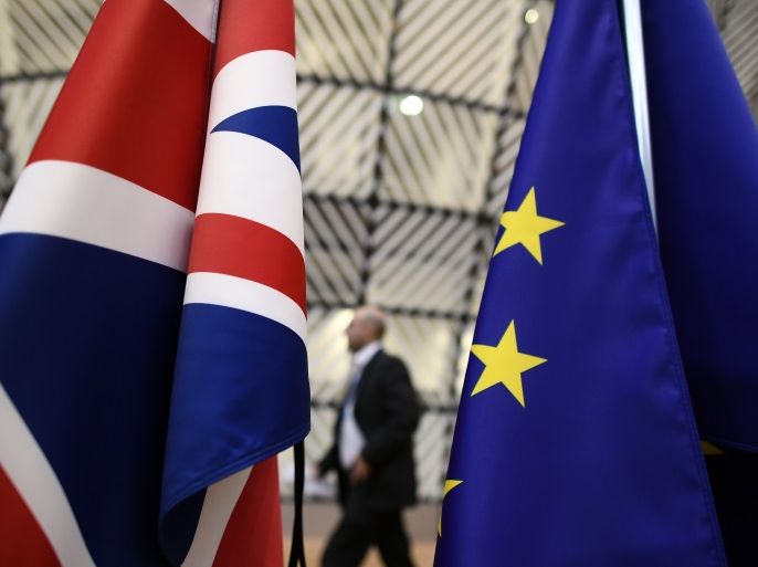 BRUSSELS, BELGIUM - MARCH 09: A man walks past British and European Union flags in the arrival area of the Europa building at the Council of the European Union on the first day of an EU summit, on March 9, 2017 in Brussels, Belgium. EU leaders will gather for a two-day summit to discuss a number of issues including Great Britain's exit from the Union. (Photo by Carl Court/Getty Images)