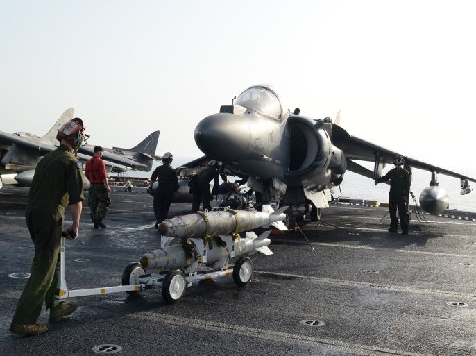 Marines prepare to load ordnance onto an AV-8B Harrier II on the flight deck of the amphibious assault ship USS Boxer in preparation for missions in support of Operation Inherent Resolve (U.S. military's operational name for the intervention against the Islamic State of Iraq and the Levant, ISIL), in the Arabian Gulf, June 16, 2016. Mass Communication Specialist 1st Class Brian Caracci/U.S. Navy/Handout via Reuters ATTENTION EDITORS - THIS IMAGE WAS PROVIDED BY A THIRD PARTY. EDITORIAL USE ONLY