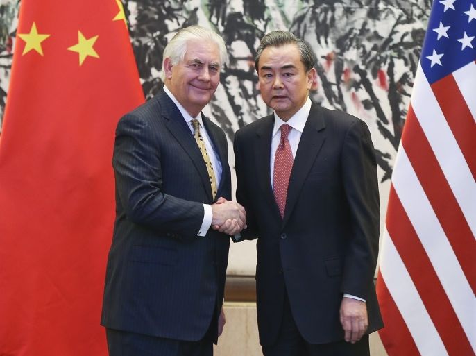 BEIJING, CHINA - MARCH 18: Chinese Foreign Minister Wang Yi (R) shakes hands with U.S. Secretary of State Rex Tillerson after a joint press conference at Diaoyutai State Guesthouse on March 18, 2017 in Beijing, China. Tillerson is on his first visit to Asia as Secretary of State. (Photo by Lintao Zhang - Pool/Getty Images)