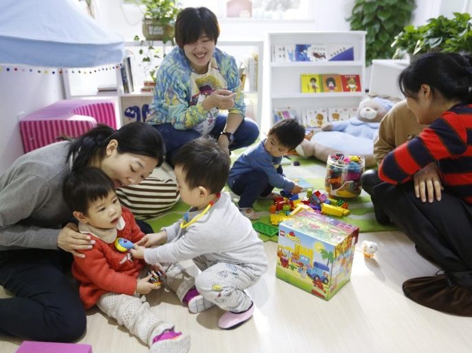 A picture made available on 28 December 2016 shows Chinese parents and their children playing together at the Magic International Daycare, a high end child care center in Beijing, China, 22 December 2016. Magic International Daycare is a new high end day care center for children aged zero to four years old, using the Montessori educational method and bilingual programs with local and foreign teachers. While the school features first-rate facilities such as top-tier air