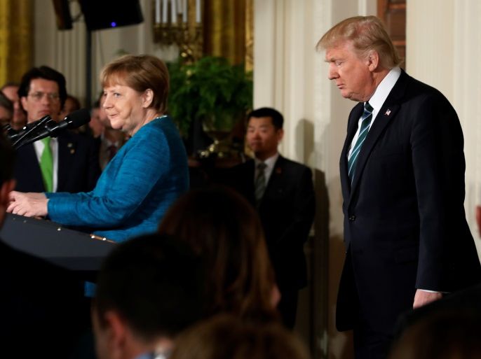 Germany's Chancellor Angela Merkel and U.S. President Donald Trump arrive for a joint news conference in the East Room of the White House in Washington, U.S., March 17, 2017. REUTERS/Jonathan Ernst