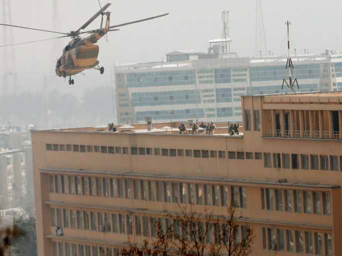 Afghan National Army (ANA) soldiers descend from helicopter on a roof of a military hospital during gunfire and blast in Kabul, Afghanistan March 8, 2017.REUTERS/Mohammad Ismail