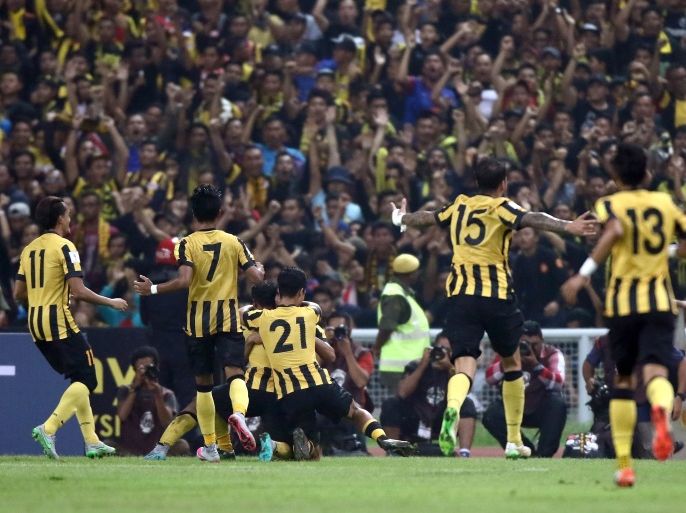 KUALA LUMPUR, MALAYSIA - SEPTEMBER 08: Malaysian players celebrate after scoring against Saudi Arabia during the 2018 Russia FIFA World Cup and 2019 UAE Asian Cup Preliminary Round 2 joint qualifying match between Malaysia and Saudi Arabia at the Shah Alam Stadium on September 8, 2015 in Kuala Lumpur, Malaysia. (Photo by Stanley Chou/Getty Images)