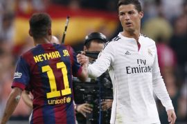 Real Madrid's Cristiano Ronaldo (rear) greets Barcelona's Neymar after their Spanish first division