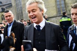 Dutch far-right politician Geert Wilders of the PVV party reacts as a dog barks at him as he campaigns in Valkenburg, Netherlands, March 11, 2017. REUTERS/Dylan Martinez