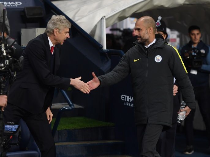 MANCHESTER, ENGLAND - DECEMBER 18: Arsene Wenger, Manager of Arsenal (L) and Josep Guardiola, Manager of Manchester City (R) shake hands prior to kick off during the Premier League match between Manchester City and Arsenal at the Etihad Stadium on December 18, 2016 in Manchester, England. (Photo by Michael Regan/Getty Images)