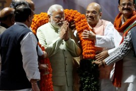 India's Prime Minister Narendra Modi is being garlanded by party leaders during a ceremony at Bharatiya Janata Party (BJP) headquarters in New Delhi, India, March 12, 2017. REUTERS/Adnan Abidi