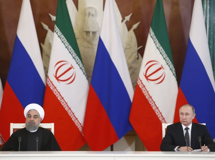 Russian President Vladimir Putin and Iranian President Hassan Rouhani attend a signing ceremony following their meeting at the Kremlin in Moscow, Russia March 28, 2017. REUTERS/Sergei Karpukhin