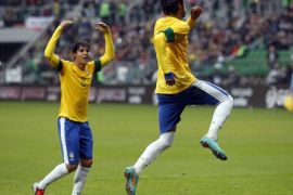 Brazil's Neymar celebrates penalty with Kaka during friendly soccer match against Japan in Wroclaw