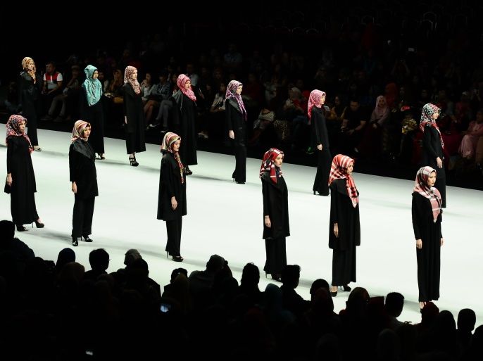 JAKARTA, INDONESIA - FEBRUARY 21: A model showcases Hijab designs by El Zatta on the runway during Indonesia Fashion Week 2014 day 2 at Jakarta Convention Center on February 21, 2014 in Jakarta, Indonesia. (Photo by Robertus Pudyanto/Getty Images)