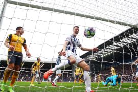WEST BROMWICH, ENGLAND - MARCH 18: Jonny Evans of West Bromwich Albion (C) celebrates as Craig Dawson of West Bromwich Albion (not pictured) scores his sides first goal during the Premier League match between West Bromwich Albion and Arsenal at The Hawthorns on March 18, 2017 in West Bromwich, England. (Photo by Matthew Lewis/Getty Images)