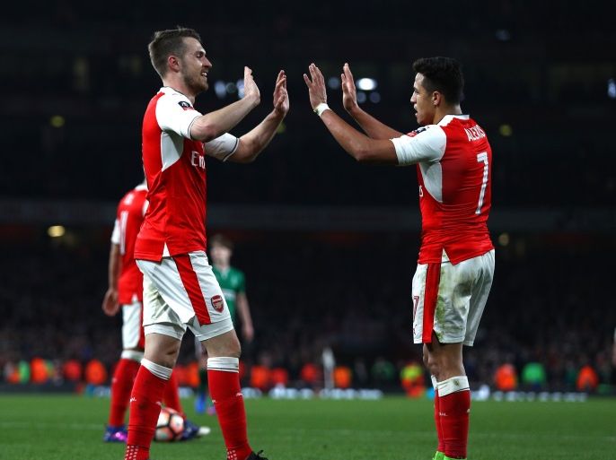 LONDON, ENGLAND - MARCH 11: Aaron Ramsey of Arsenal (L) celebrates scoring his sides fifth goal with Alexis Sanchez of Arsenal (R) during The Emirates FA Cup Quarter-Final match between Arsenal and Lincoln City at Emirates Stadium on March 11, 2017 in London, England. (Photo by Ian Walton/Getty Images)