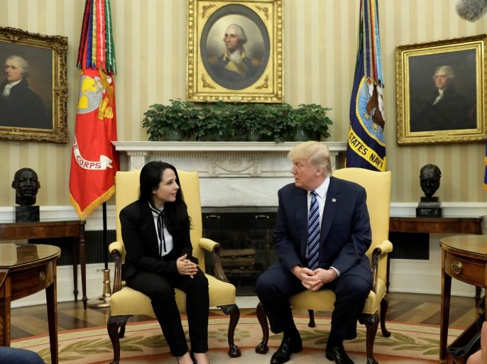 Aya Hijazi, an Egyptian-American woman detained in Egypt for nearly three years on human trafficking charges, meets with U.S. President Donald Trump in the Oval Office of the White House in Washington, U.S., April 21, 2017. REUTERS/Kevin Lamarque