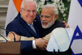 Israeli President Reuven Rivlin and India's Prime Minister Narendra Modi hug each other after reading their joint statement at Hyderabad House in New Delhi, India, November 15, 2016. REUTERS/Adnan Abidi TPX IMAGES OF THE DAY