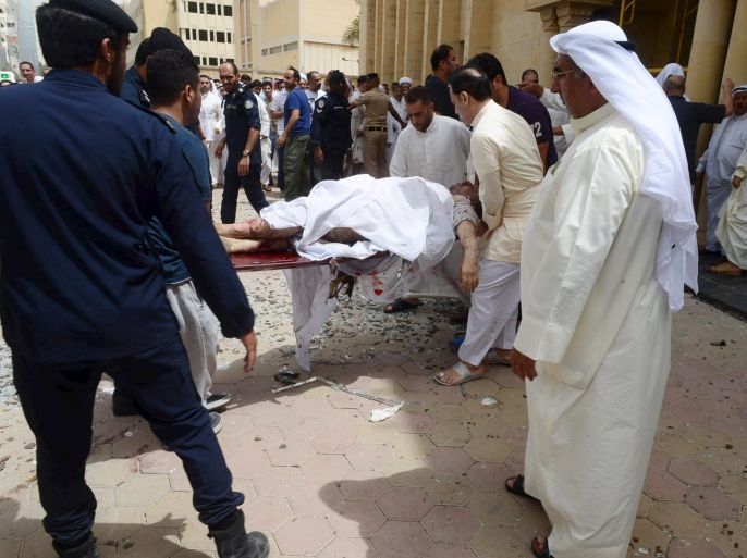 ATTENTION EDITORS - VISUAL COVERAGE OF SCENES OF INJURY OR DEATHPolice carry a victim out of the Shi'ite Imam al-Sadeq Mosque in the Al Sawaber area of Kuwait City, after a bomb explosion, June 26, 2015. A suicide bomber killed 25 people when he blew himself up inside the packed Shi'ite Muslim mosque in Kuwait city during Friday prayers, the interior ministry said, the first attack of its kind in the major oil-exporting country. The Islamic State militant group claime