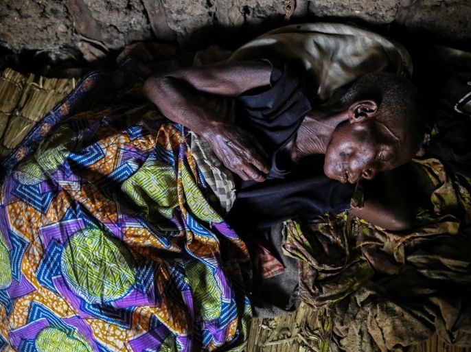 A woman, 60, who is suffering from malaria rests in her house at Kagorwa Pygmy camp on Idjwi island in the Democratic Republic of Congo, November 22, 2016. The woman died from her illness a few days later. REUTERS/Therese Di Campo SEARCH