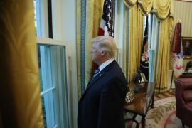 U.S. President Donald Trump looks out a window of the Oval Office following an interview with Reuters at the White House in Washington, U.S., April 27, 2017.