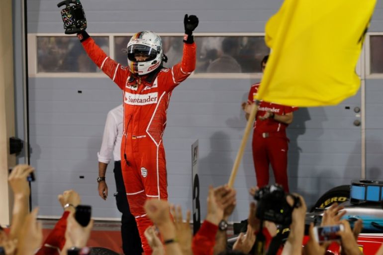 Formula One - F1 - Bahrain Grand Prix - Sakhir, Bahrain - 16/04/17 - Ferrari Formula One driver Sebastian Vettel of Germany celebrates after winning Bahrain Grand Prix. REUTERS/Hamad I Mohammed