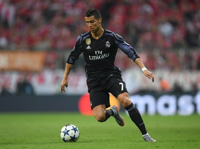 MUNICH, GERMANY - APRIL 12: Cristiano Ronaldo of Real Madrid controls the ball during the UEFA Champions League Quarter Final first leg match between FC Bayern Muenchen and Real Madrid CF at Allianz Arena on April 12, 2017 in Munich, Germany. (Photo by Matthias Hangst/Bongarts/Getty Images)