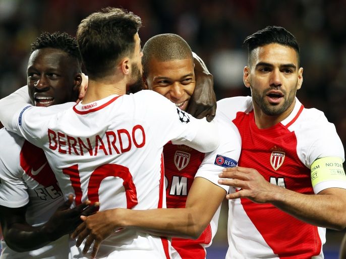 epa05915829 Monaco's Kylian Mbappe (2-R) celebrates with his teammates after scoring the 1-0 lead during the UEFA Champions League quarter final, second leg soccer match between AS Monaco and Borussia Dortmund at Stade Louis II in Monaco, 19 April 2017. EPA/SEBASTIEN NOGIER