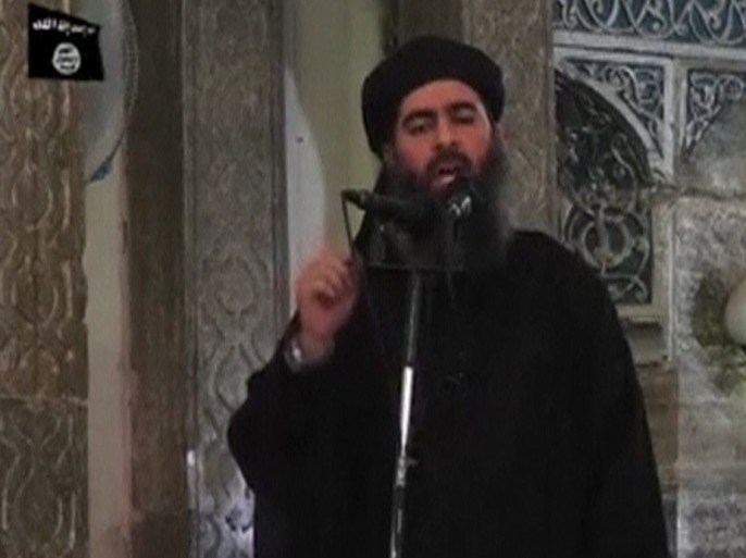 A man purported to be the reclusive leader of the militant Islamic State Abu Bakr al-Baghdadi has made what would be his first public appearance at a mosque in the centre of Iraq's second city, Mosul, according to a video recording posted on the Internet on July 5, 2014, in this still image taken from video. There had previously been reports on social media that Abu Bakr al-Baghdadi would make his first public appearance since his Islamic State in Iraq and the Levant (ISIL) changed its name to the Islamic State and declared him caliph. The Iraqi government denied that the video, which carried Friday's date, was credible. It was also not possible to immediately confirm the authenticity of the recording or the date when it was made. REUTERS/Social Media Website via Reuters TV (IRAQ - Tags: POLITICS) ATTENTION EDITORS - THIS IMAGE HAS BEEN SUPPLIED BY A THIRD PARTY. IT IS DISTRIBUTED, EXACTLY AS RECEIVED BY REUTERS, AS A SERVICE TO CLIENTS. REUTERS IS UNABLE TO INDEPENDENTLY VERIFY THE CONTENT OF THIS VIDEO, WHICH HAS BEEN OBTAINED FROM A SOCIAL MEDIA WEBSITE