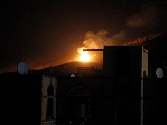 An explosion at a military arms depot is seen after it was hit by a Saudi-led air strike on the Nuqom Mountain overlooking Yemen's capital Sanaa, October 14, 2016. REUTERS/Mohamed al-Sayaghi