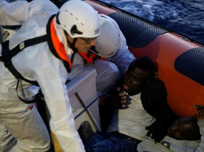 Unconscious migrants are brought from one of several boats to the Malta-based NGO Migrant Offshore Aid Station (MOAS) ship Phoenix in the central Mediterranean in international waters off the coast of Sabratha in Libya, April 15, 2017. REUTERS/Darrin Zammit Lupi