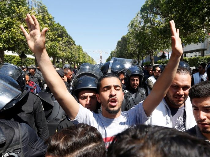 Law students clash with riot police officers, during a demonstration against the government in Tunis, Tunisia April 14, 2017. REUTERS/Zoubeir Souissi