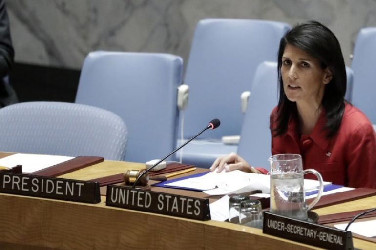 epa05895309 United States Ambassador to the United Nations and current Security Council President Nikki Haley (R) talks to members of the United Nations (UN) Security Council on the situation in Syria at UN headquarters in New York, New York, USA, 07 April 2017. EPA/JASON SZENES