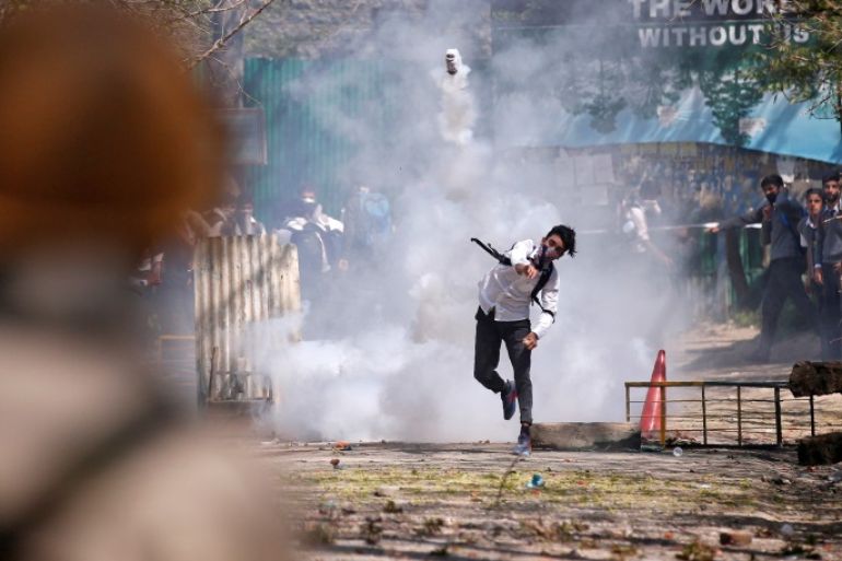 A Kashmiri student throws back a tear-gas canister fired by Indian police during a protest in Srinagar April 17, 2017. REUTERS/Danish Ismail