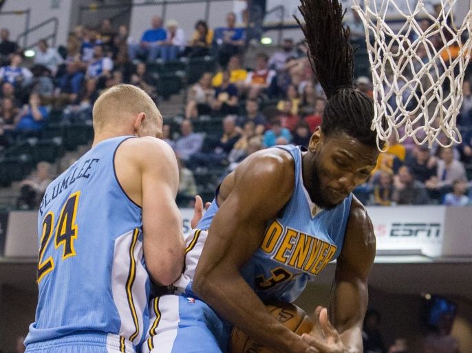 Mar 24, 2017; Indianapolis, IN, USA; Denver Nuggets forward Kenneth Faried (35) pulls down a rebound in the second half of the game against the Indiana Pacers at Bankers Life Fieldhouse. The Denver Nuggets beat the Indiana Pacers 125-117. Mandatory Credit: Trevor Ruszkowski-USA TODAY Sports