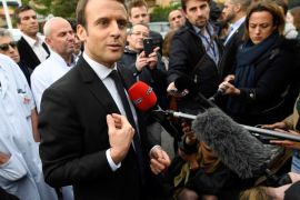 Emmanuel Macron (C), head of the political movement En Marche !, or Onwards !, and candidate for the 2017 French presidential election, speaks to journalists during a visit to the Hopital Raymond-Poincare in Garches, near Paris, France, April 25, 2017. REUTERS/Lionel Bonaventure/Pool