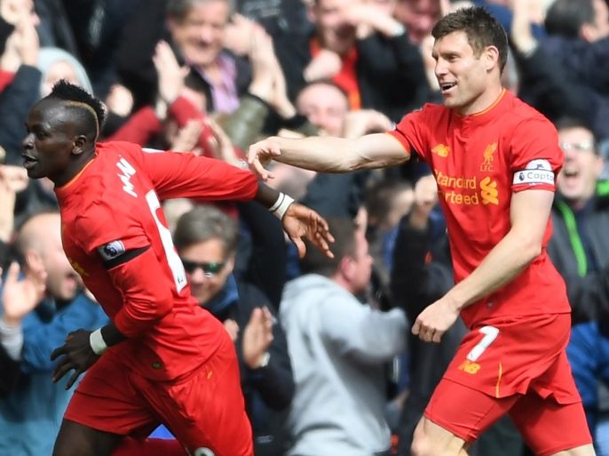 LIVERPOOL, ENGLAND - APRIL 01: Sadio Mane of Liverpool (L) celebrates scoring his sides first goal with James Milner of Liverpool (R) during the Premier League match between Liverpool and Everton at Anfield on April 1, 2017 in Liverpool, England. (Photo by Gareth Copley/Getty Images)