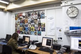 An Israeli soldier from Galei Tzahal, the Israeli army radio station, sits in front of a computer as she edits music at the station's studios in Jaffa, south of central Tel Aviv November 10, 2013. The Israeli military operates two radio stations, a news-based station that started broadcasting in 1950, and Galgalatz, a popular music station marking its 20th anniversary. The stations mostly employ soldiers who work alongside civilian presenters, including leading names i