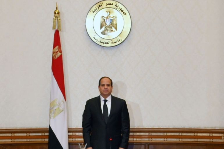 Egyptian President Abdel Fattah al-Sisi stands and observes a minute of silence for the victims of two separate church attacks during Palm Sunday prayers, with leaders of the Supreme Council of the Armed Forces and the Supreme Council for Police to discuss developments in the security situation in Egypt, as well as developments in the country's fight against terrorism, at the Ittihadiya presidential palace in Cairo, Egypt, April 9, 2017, in this handout picture courtes