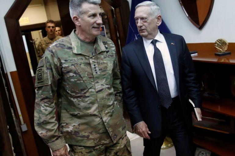 U.S. Defense Secretary James Mattis (R) and U.S. Army General John Nicholson (L), commander of U.S. Forces Afghanistan, arrive to meet with an Afghan defense delegation at Resolute Support headquarters in Kabul, Afghanistan April 24, 2017. REUTERS/Jonathan Ernst
