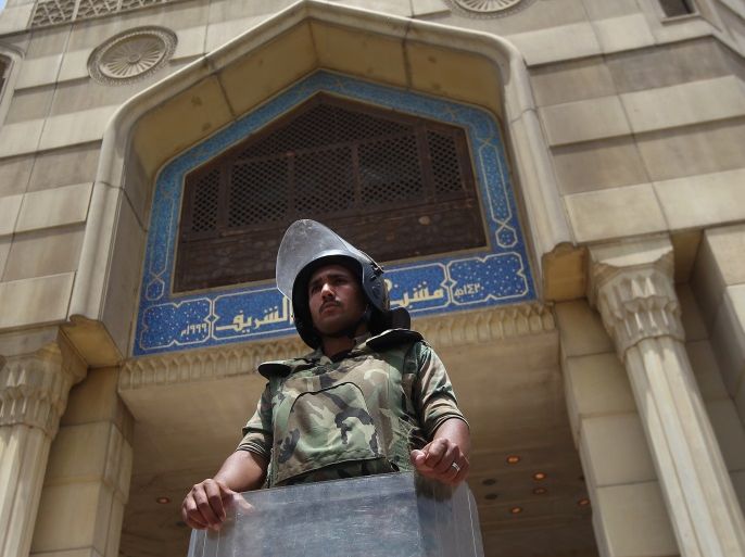 CAIRO, EGYPT - MAY 24: An Egyptian army soldier looks out over Cairo from Al-Azhar on the second day of Egypt's presidential election on May 24, 2012 in Cairo, Egypt. If no candidate wins an outright majority of the vote, the election would go to a second round June 16-17. (Photo by John Moore/Getty Images)