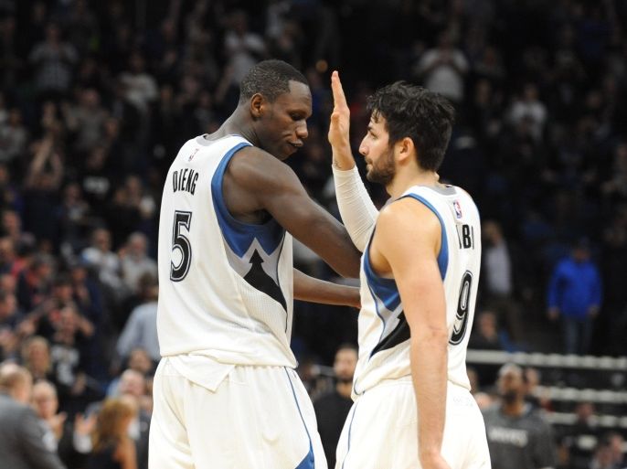 Apr 3, 2017; Minneapolis, MN, USA; Minnesota Timberwolves forward Gorgui Dieng (5) and guard Ricky Rubio (9) celebrate a victory at Target Center. The Timberwolves won 110-109. Mandatory Credit: Marilyn Indahl-USA TODAY Sports
