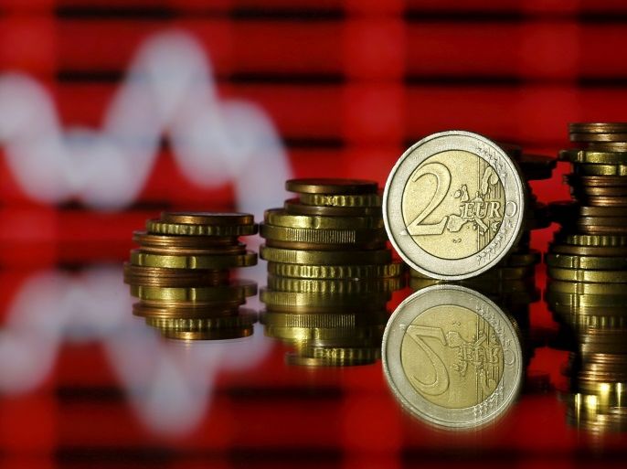 Euro coins are seen in front of a displayed stock graph in this photo illustration taken June 30, 2015. REUTERS/Dado Ruvic/Illustration/File Photo