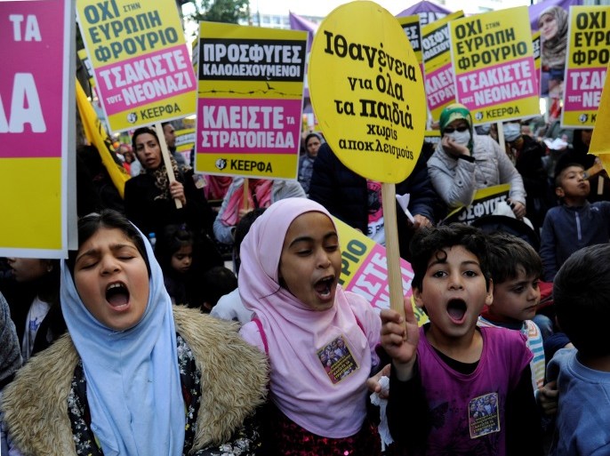 Refugee children shout slogans during a demonstration against racism in Athens, Greece, March 18, 2017. REUTERS/Michalis Karagiannis
