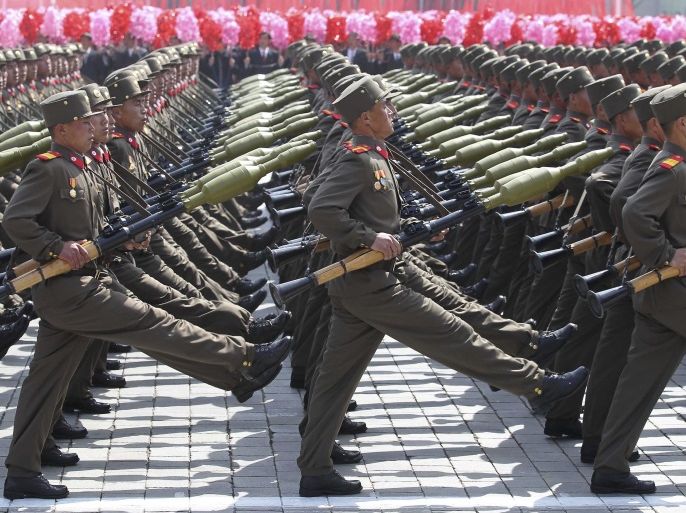 Soldiers march past the podium during a military parade to celebrate the centenary of the birth of DPRK's founder Kim Il-sung in Pyongyang April 15, 2012. DPRK's new leader Kim Jong Un delivered his first major public speech on Sunday as the country celebrated the centenary of its founder's birth. Picture taken April 15, 2012. REUTERS/Stringer (NORTH KOREA - Tags: POLITICS ANNIVERSARY MILITARY) CHINA OUT. NO COMMERCIAL OR EDITORIAL SALES IN CHINA