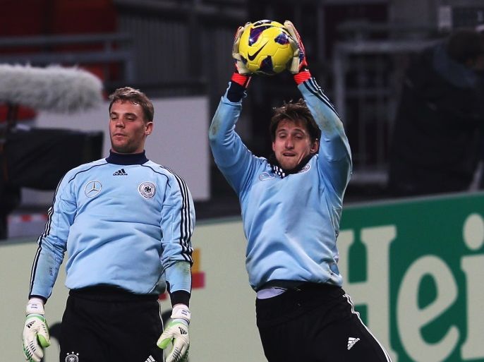 AMSTERDAM, NETHERLANDS - NOVEMBER 13: Rene Adler (R) and Manuel Neuer of Germany in action during a training session, on the eve of their friendly international match against the Netherlands, at Amsterdam Arena on November 13, 2012 in Amsterdam, Netherlands. (Photo by Joern Pollex/Bongarts/Getty Images)