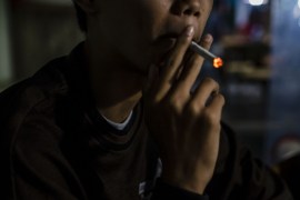 YOGYAKARTA, INDONESIA - MARCH 07: Anggit (14), smokes at a coffee shop with his friends on March 7, 2017 in Yogyakarta, Indonesia. Smoking among Indonesian children has reportedly been on the rise with an estimated 20 million child smokers under the age of 10, according to reports. The Indonesian government recently implemented bans on smoking in public places and prohibitions on cigarette ads to reduce the number of people lighting up although smoking has been ingraine