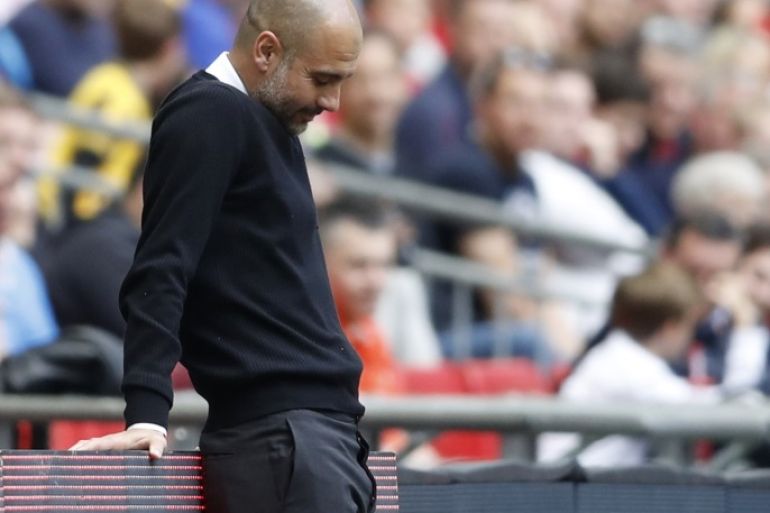 Britain Football Soccer - Arsenal v Manchester City - FA Cup Semi Final - Wembley Stadium - 23/4/17 Manchester City manager Pep Guardiola looks dejected Action Images via Reuters / Carl Recine Livepic EDITORIAL USE ONLY. No use with unauthorized audio, video, data, fixture lists, club/league logos or